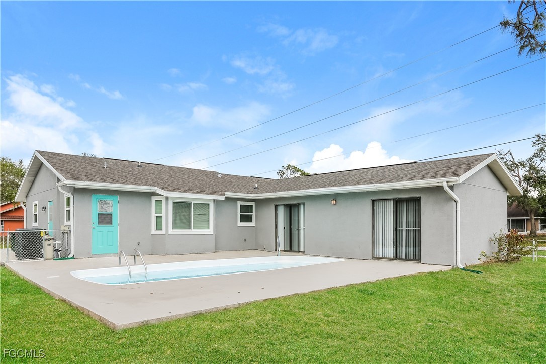 4007 Allure Lane North Port, FL 34287 - Photo 16 of 16 a view of a house with a yard and garage