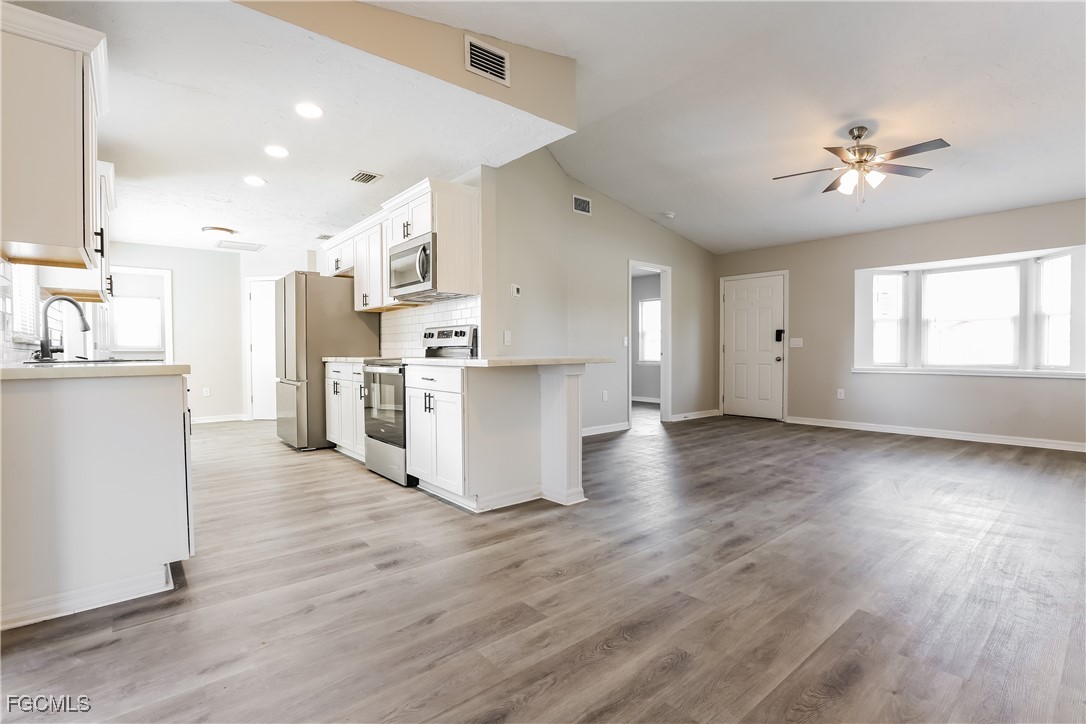 4007 Allure Lane North Port, FL 34287 - Photo 2 of 16 a view of a kitchen with wooden floor and a kitchen