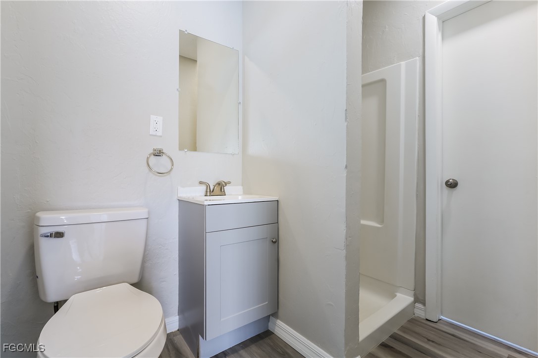 4007 Allure Lane North Port, FL 34287 - Photo 8 of 16 a white toilet sitting next to a bathroom sink