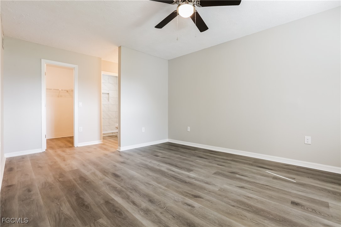 4007 Allure Lane North Port, FL 34287 - Photo 9 of 16 a view of an empty room with wooden floor