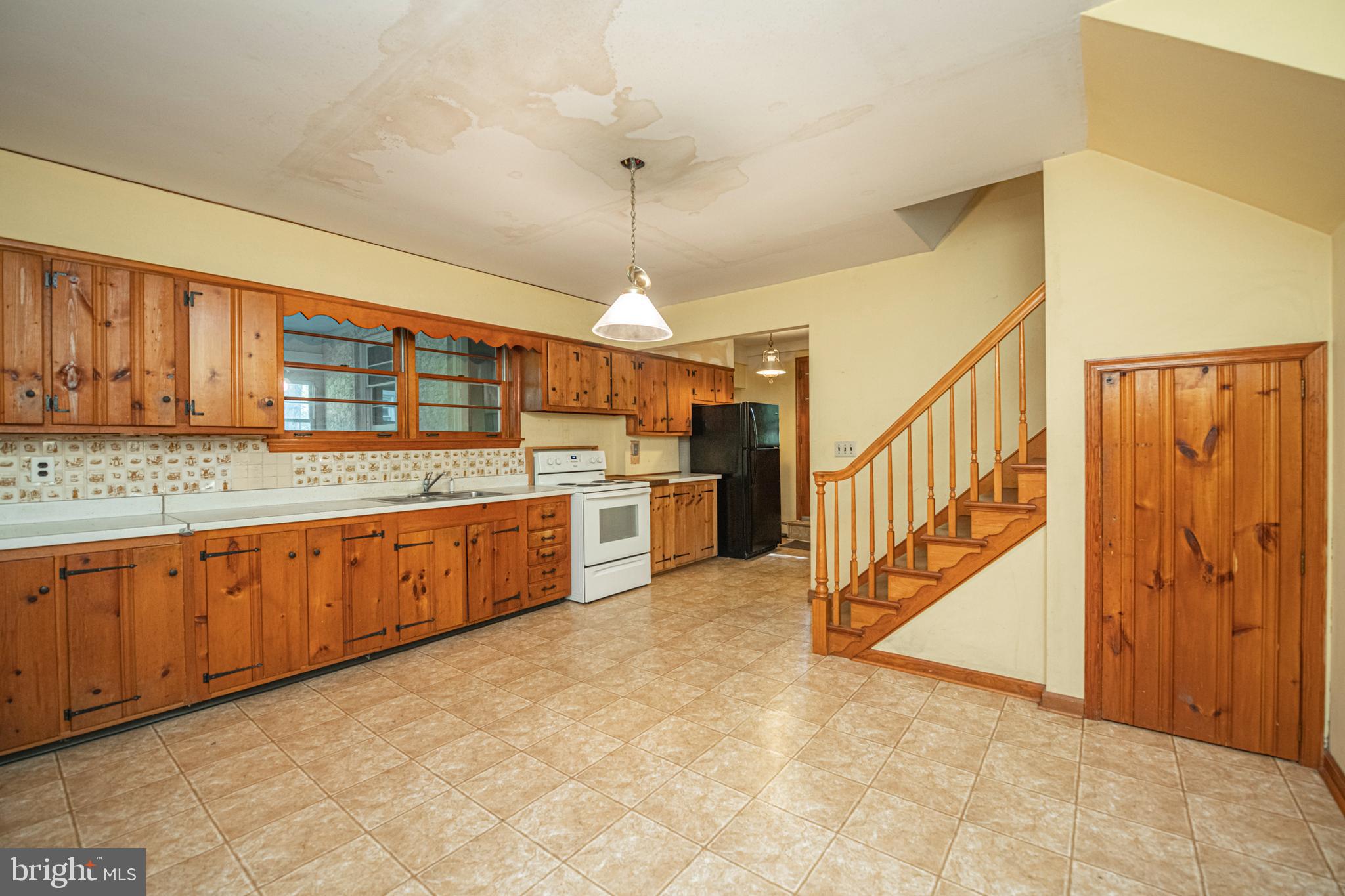437 Pawlings Road Phoenixville, PA 19460 - Photo 10 of 58 Large Kitchen Stairs to 2nd Floor