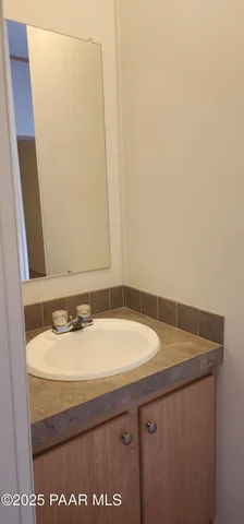 a view of a bedroom with bed and dresser