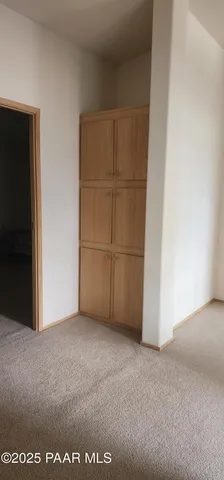 a bedroom with a bed and a cabinets
