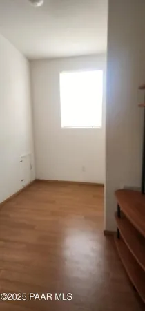 a bathroom with a sink a mirror and a window