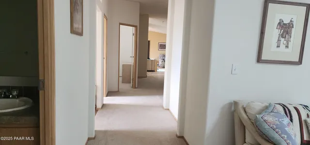 a backyard of a house with wooden fence and trees