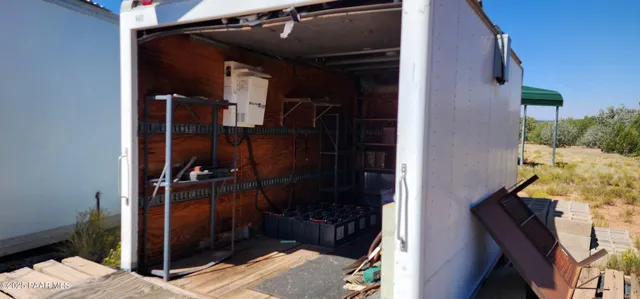 a view of a yard covered with snow in front of yard