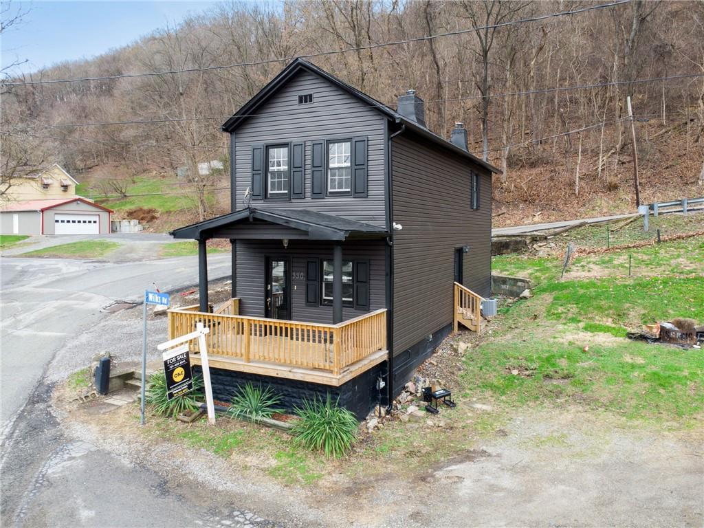 330 Braeburn Road Lower Burrell, PA 15068 - Photo 1 of 31 a view of backyard with a deck and a yard