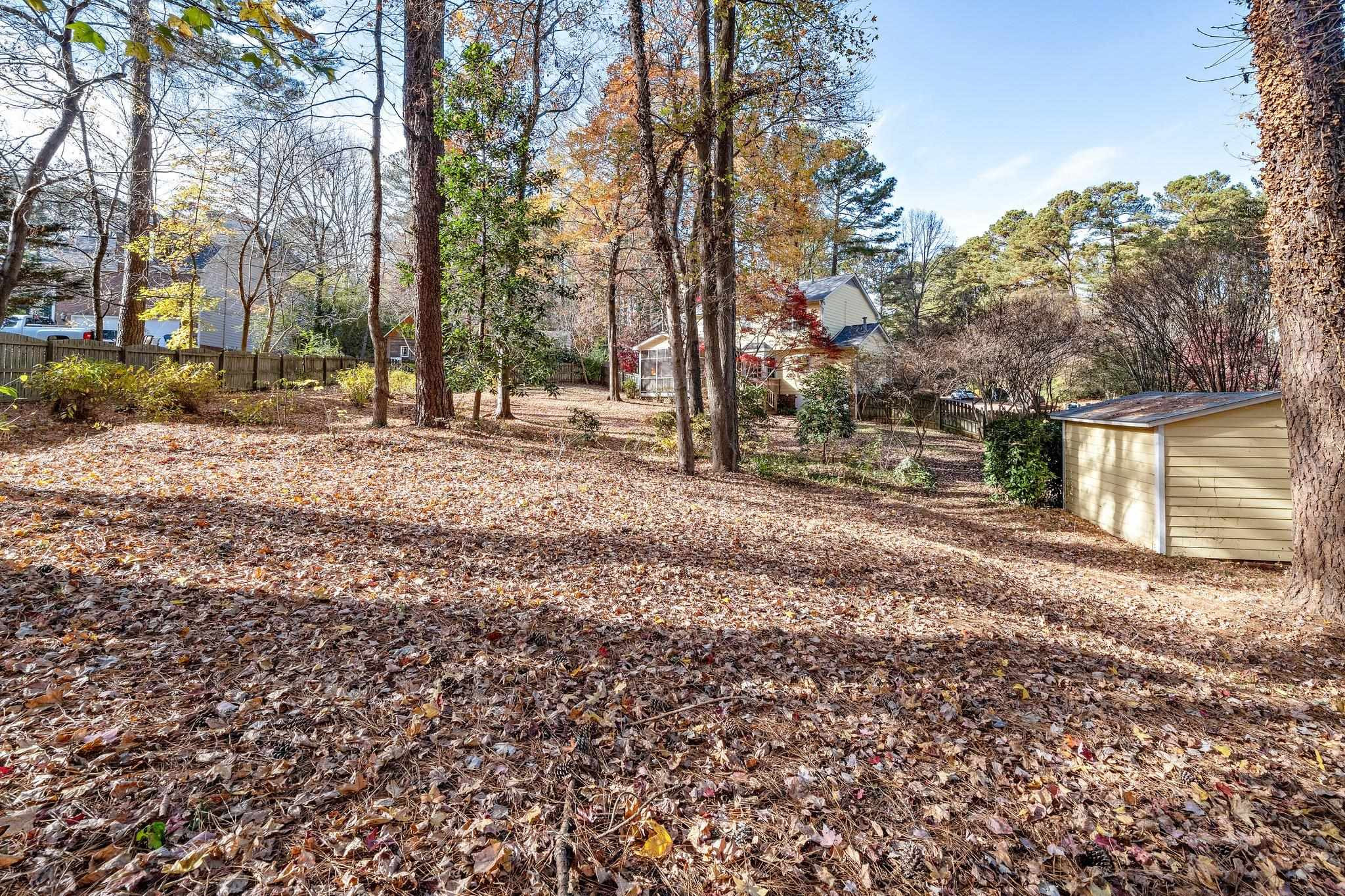 5801 Heatherbrook Circle Raleigh, NC 27612 - Photo 28 of 28 a view of a yard with trees