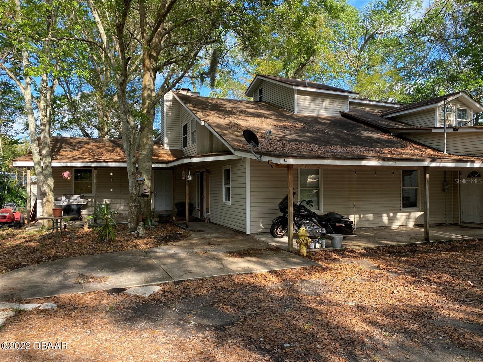 4580 Ave D St. Augustine, FL 32095 - Photo 10 of 10 a view of house with chair and tables