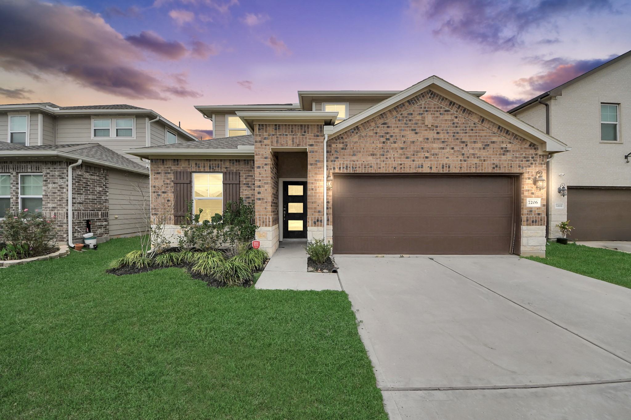 7206 Melrose Lane Rosharon, TX 77583 - Photo 1 of 44 a front view of a house with a yard and garage