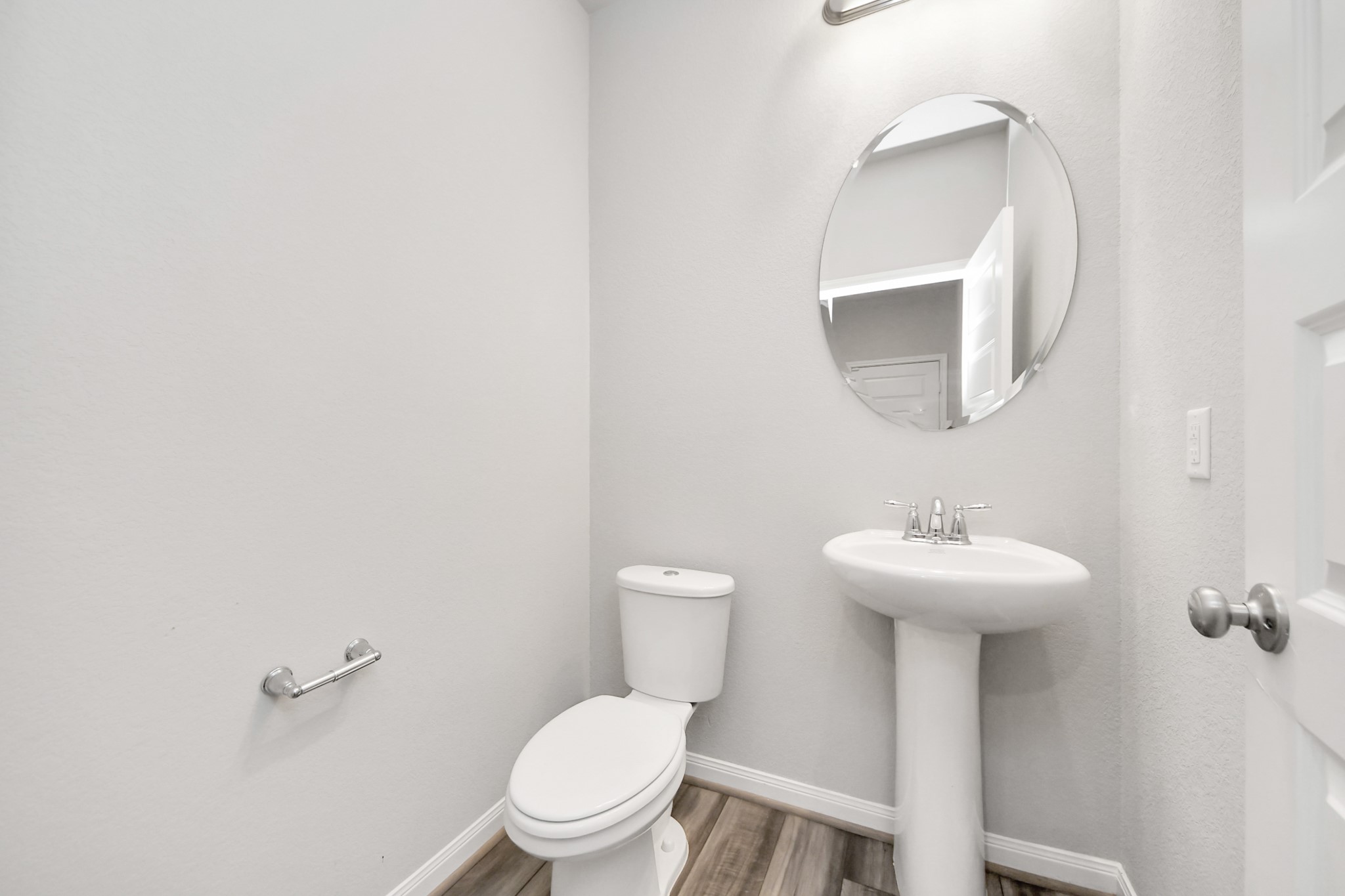 7206 Melrose Lane Rosharon, TX 77583 - Photo 12 of 44 a bathroom with a toilet sink and mirror