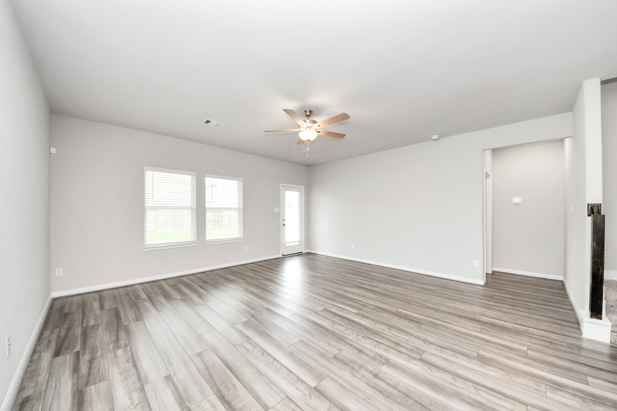 7206 Melrose Lane Rosharon, TX 77583 - Photo 17 of 44 wooden floor in an empty room with a window
