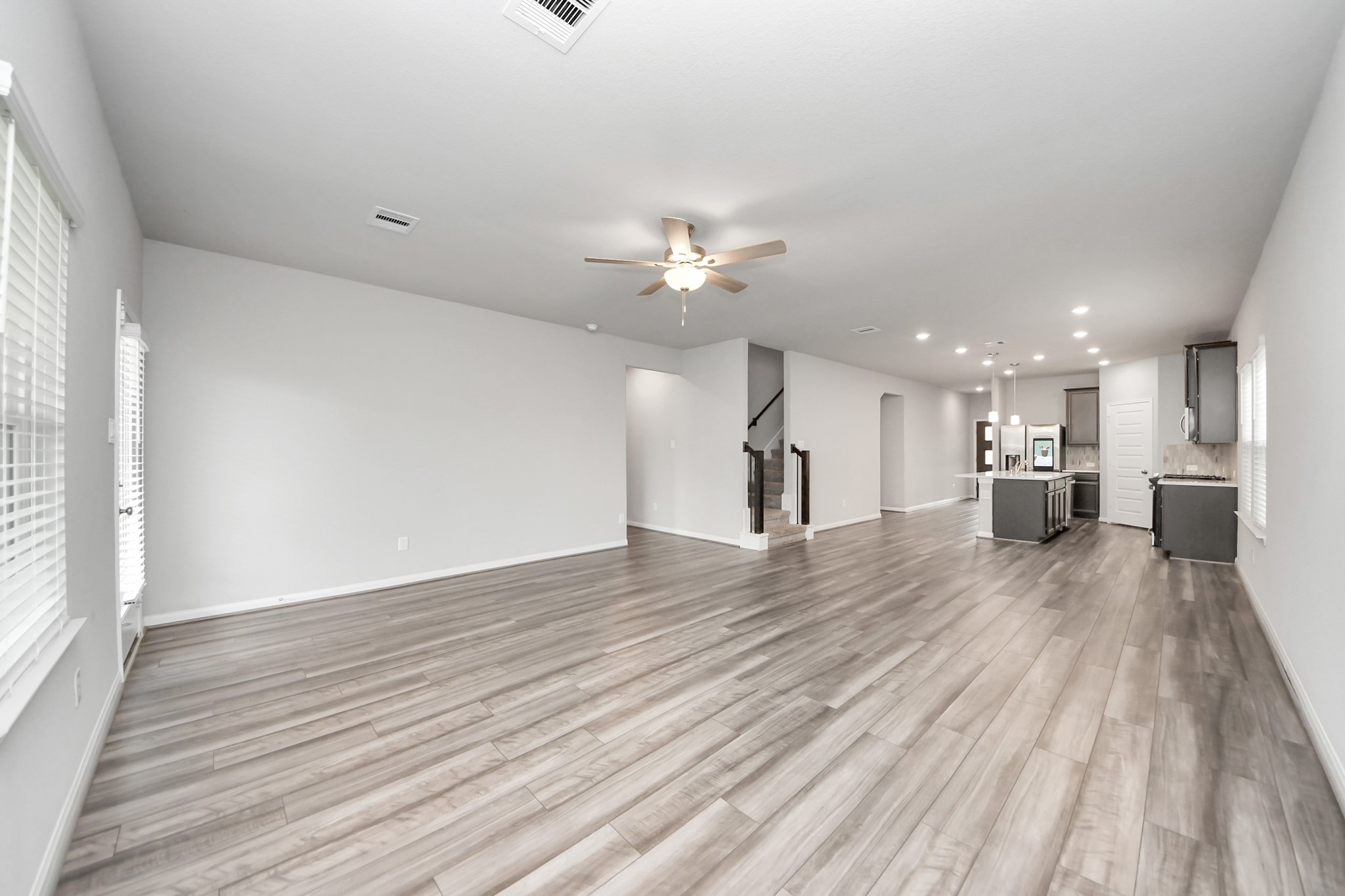 7206 Melrose Lane Rosharon, TX 77583 - Photo 18 of 44 a view of a kitchen with a sink and a wooden floor