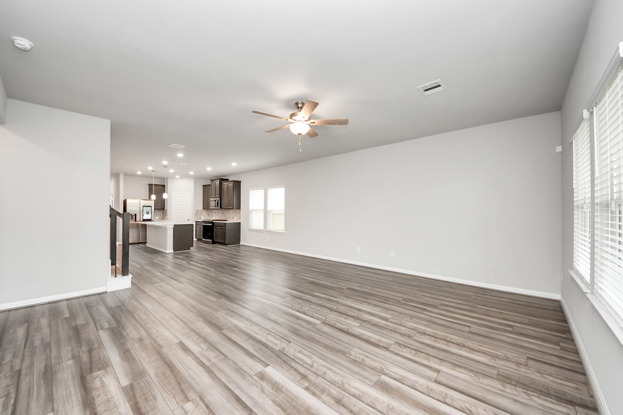 7206 Melrose Lane Rosharon, TX 77583 - Photo 19 of 44 wooden floor in an empty room with a window