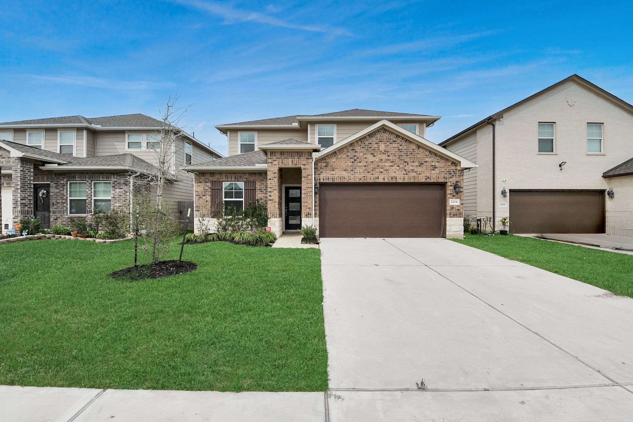 7206 Melrose Lane Rosharon, TX 77583 - Photo 2 of 44 a front view of a house with a yard and garage