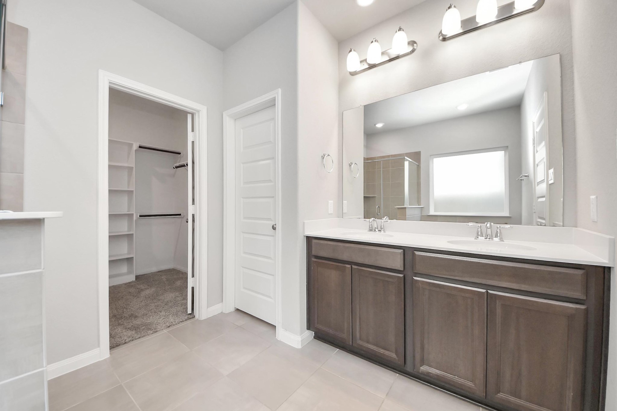 7206 Melrose Lane Rosharon, TX 77583 - Photo 24 of 44 a bathroom with a double vanity sink and a mirror