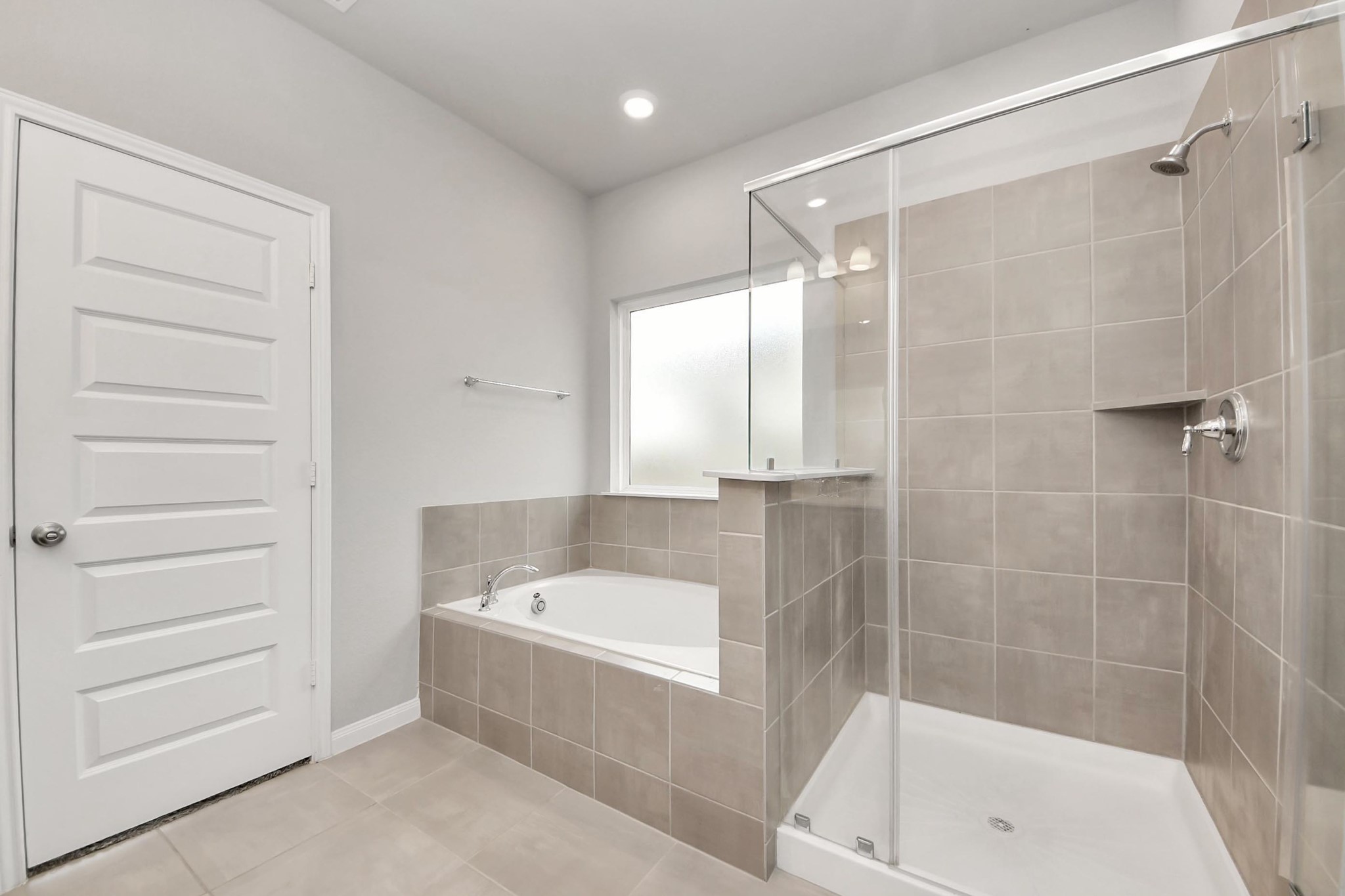 7206 Melrose Lane Rosharon, TX 77583 - Photo 26 of 44 a bathroom with a bathtub and a shower