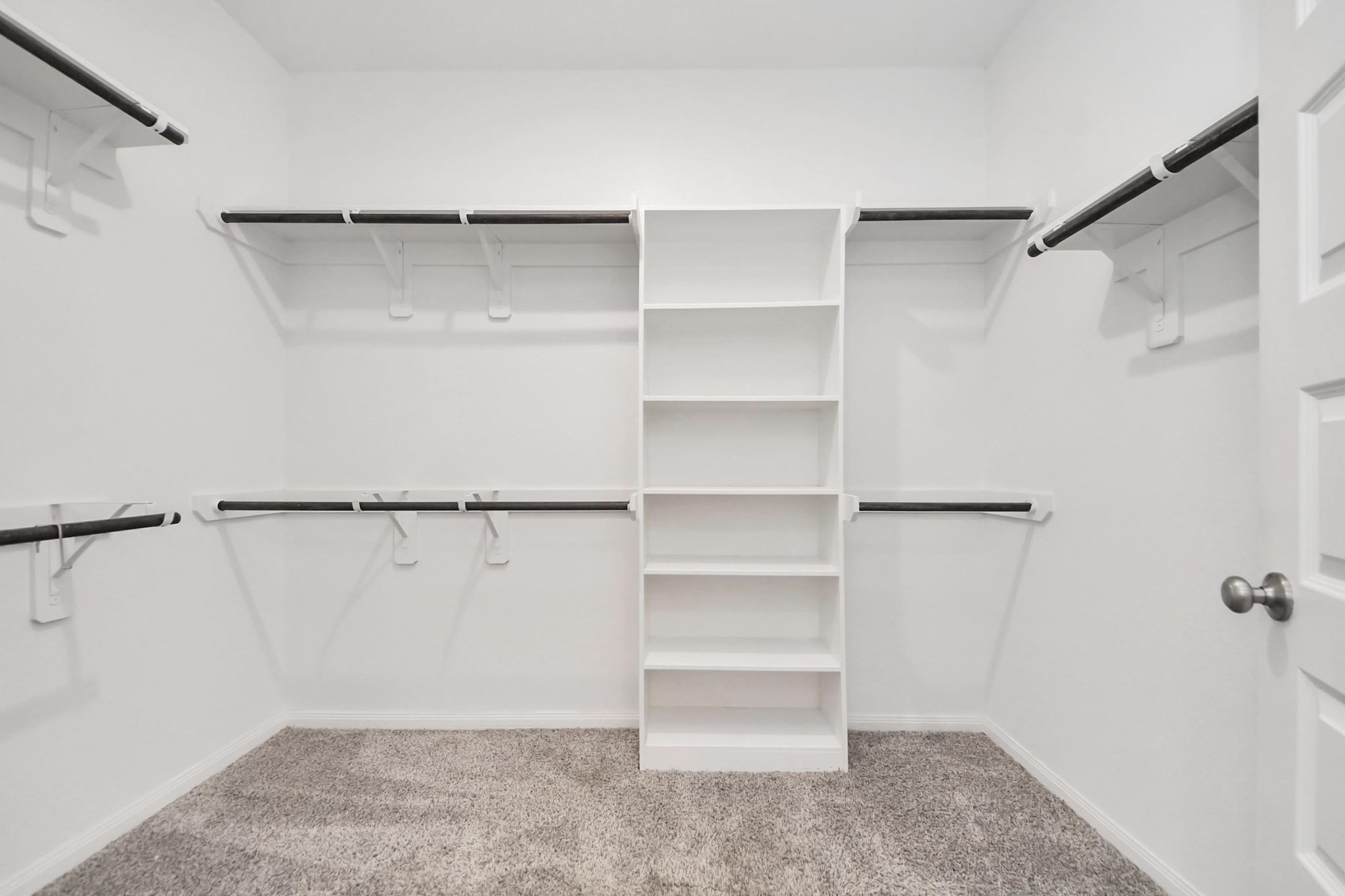 7206 Melrose Lane Rosharon, TX 77583 - Photo 28 of 44 a view of walk in closet with empty racks