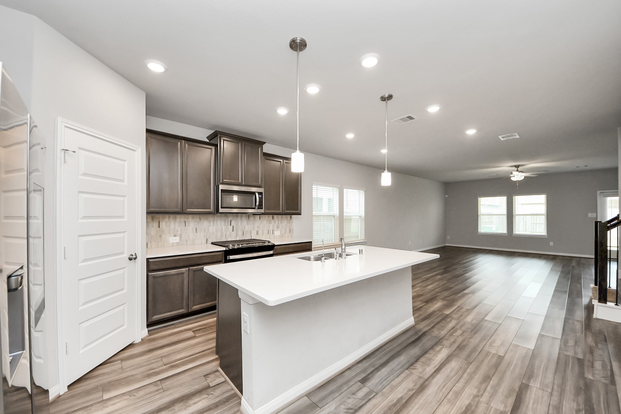 7206 Melrose Lane Rosharon, TX 77583 - Photo 6 of 44 a kitchen with stainless steel appliances granite countertop a sink stove and refrigerator