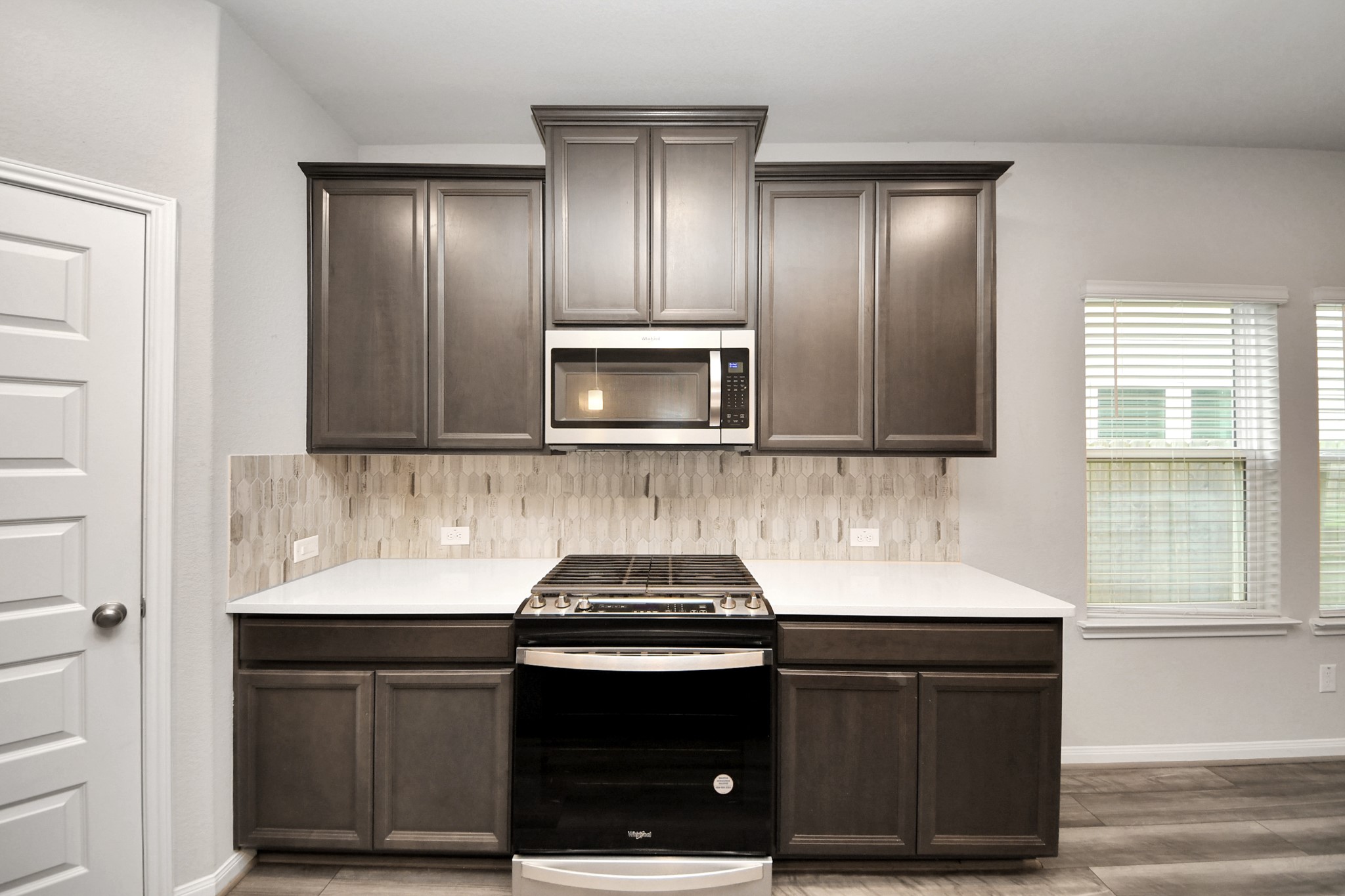7206 Melrose Lane Rosharon, TX 77583 - Photo 10 of 44 a kitchen with granite countertop stainless steel appliances and cabinets