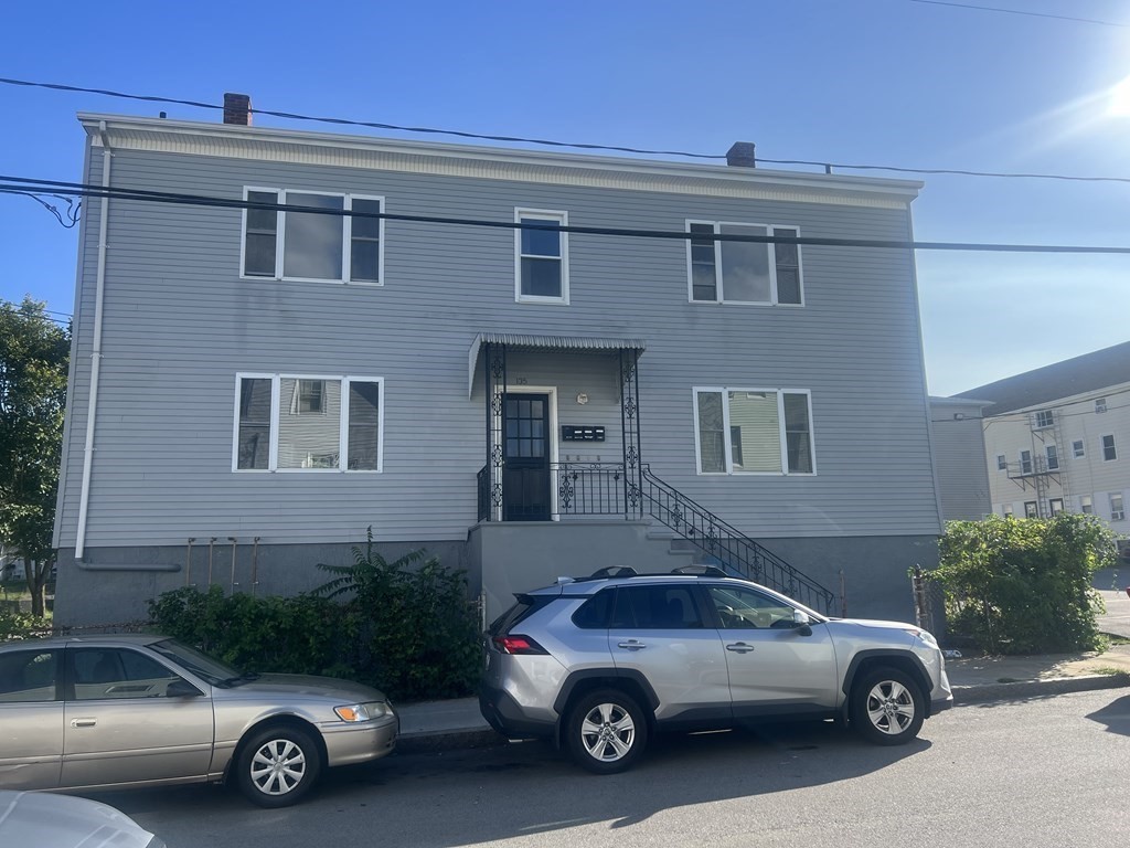 135 Snell Street Fall River, MA 02721 - Photo 1 of 29 a car parked in front of a house