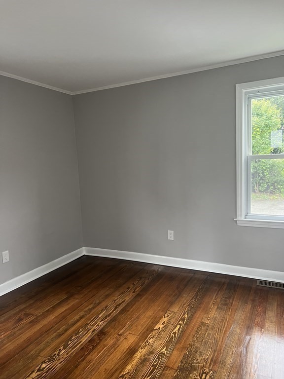 135 Snell Street Fall River, MA 02721 - Photo 14 of 29 a view of a room with wooden floor and window