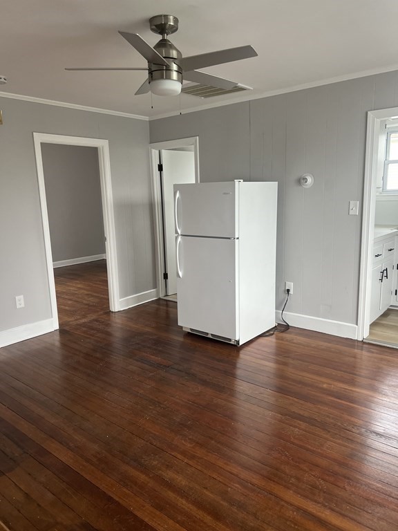 135 Snell Street Fall River, MA 02721 - Photo 15 of 29 a view of a livingroom with wooden floor and a ceiling fan