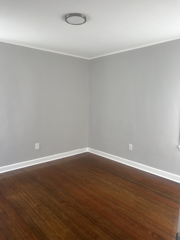 135 Snell Street Fall River, MA 02721 - Photo 21 of 29 a view of an empty room with wooden floor