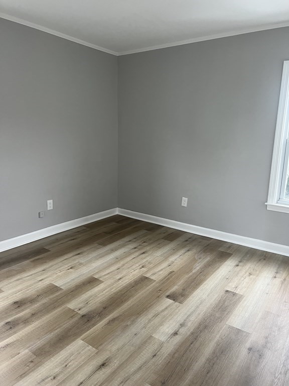 135 Snell Street Fall River, MA 02721 - Photo 24 of 29 a view of empty room with wooden floor