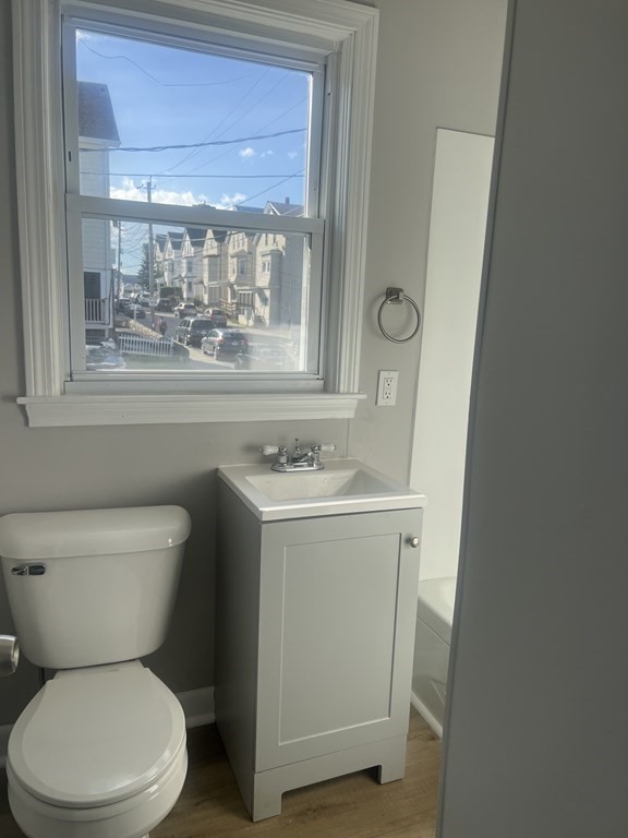 135 Snell Street Fall River, MA 02721 - Photo 26 of 29 a bathroom with a toilet sink and mirror