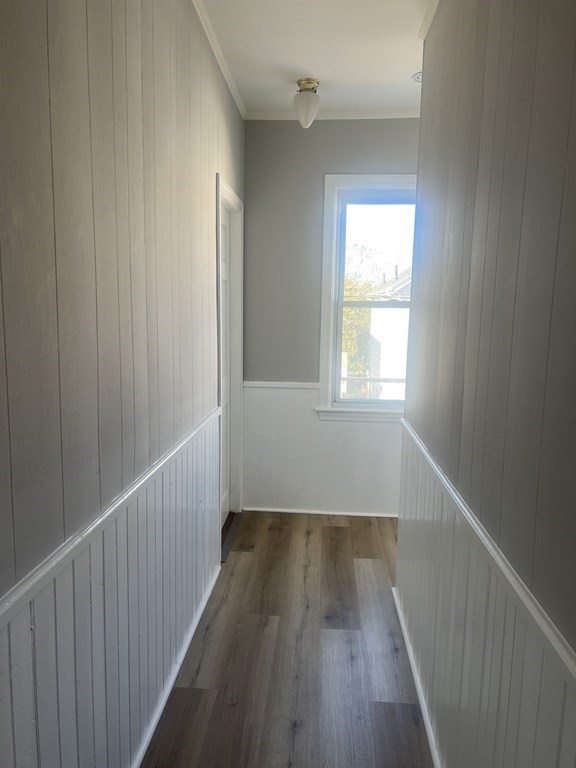 135 Snell Street Fall River, MA 02721 - Photo 27 of 29 a view of an empty room with wooden floor and a window