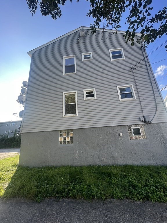 135 Snell Street Fall River, MA 02721 - Photo 3 of 29 a view of a house with a yard