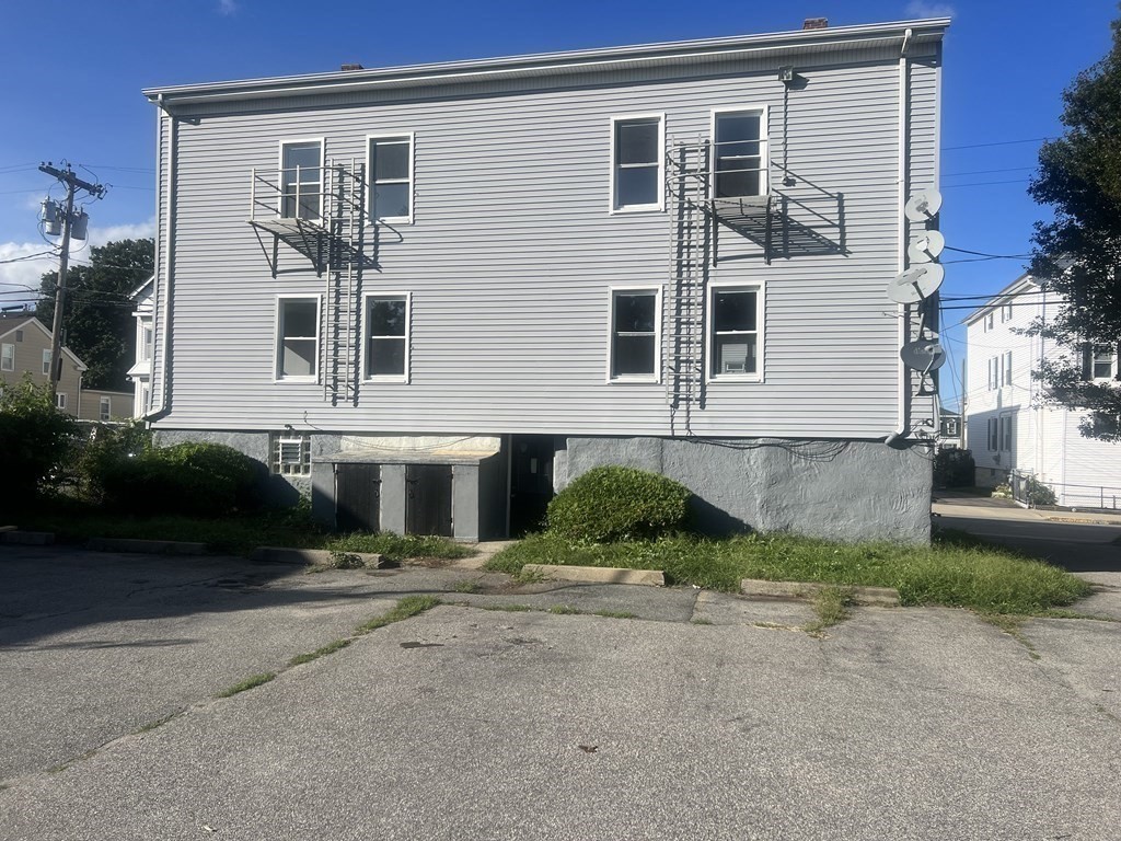 135 Snell Street Fall River, MA 02721 - Photo 4 of 29 front view of a house with a yard