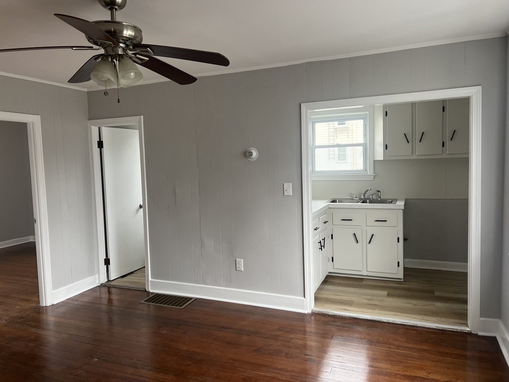 135 Snell Street Fall River, MA 02721 - Photo 7 of 29 a view of utility room with wooden floor