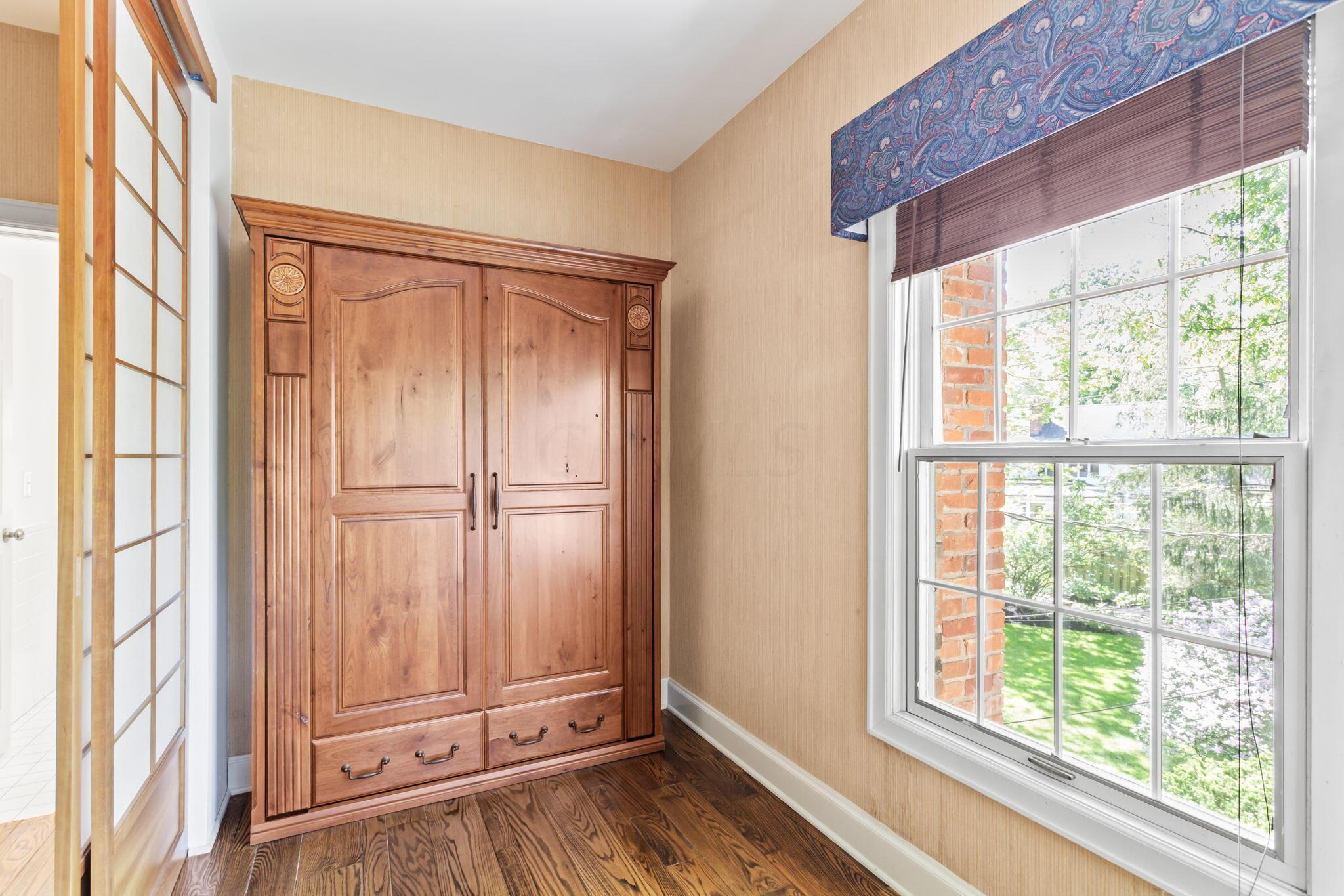 2111 Cheltenham Road Columbus, OH 43220 - Photo 42 of 64 The wooden furniture in this room is actually a Murphy bed.