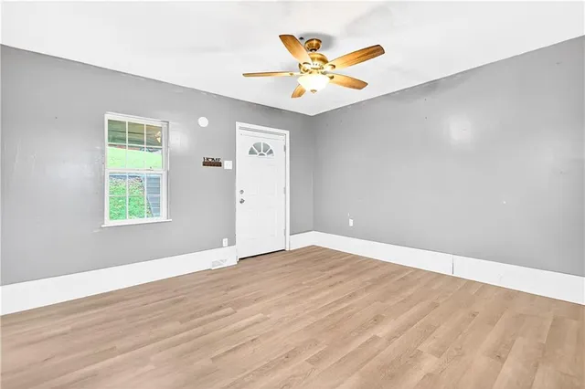 a view of an empty room with a window