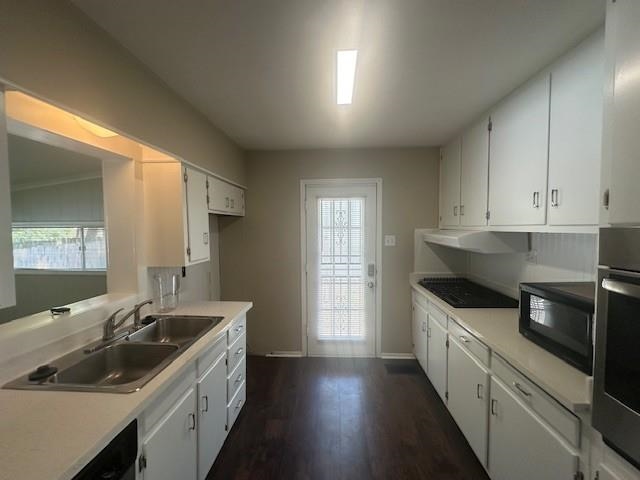 4416 Boyce Road Memphis, TN 38117 - Photo 15 of 22 Kitchen with light countertops, dark wood-type flooring, black appliances, and white cabinetry