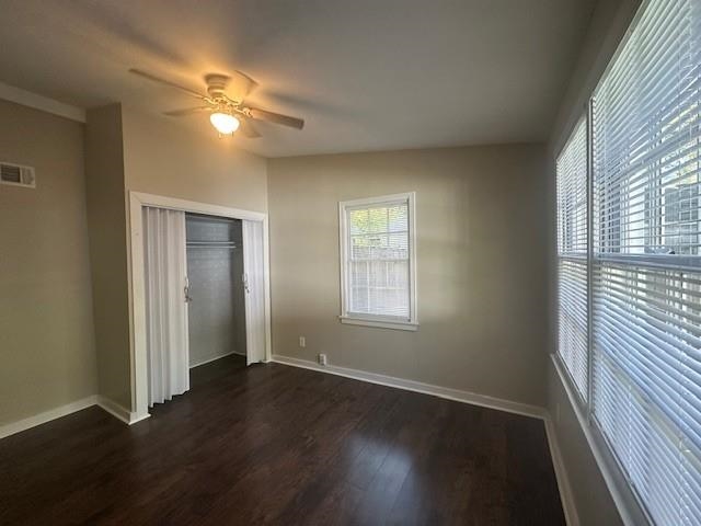 4416 Boyce Road Memphis, TN 38117 - Photo 16 of 22 Unfurnished bedroom with dark wood-style flooring, a ceiling fan, and a closet
