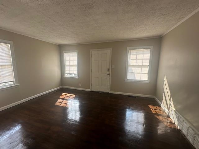 4416 Boyce Road Memphis, TN 38117 - Photo 2 of 22 Foyer entrance featuring a textured ceiling, ornamental molding, and dark wood-style floors