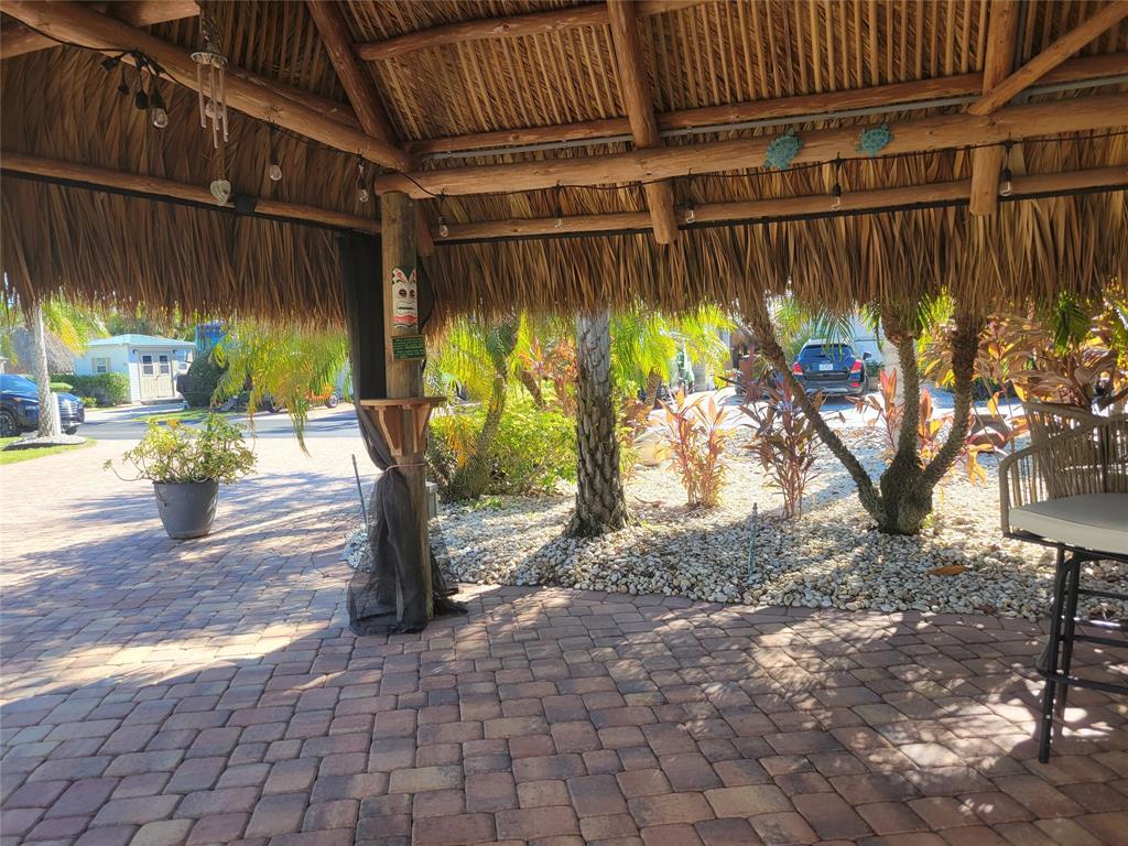 605 Southwest 40th Cove Okeechobee, FL 34974 - Photo 7 of 10 a view of a porch with wooden floor