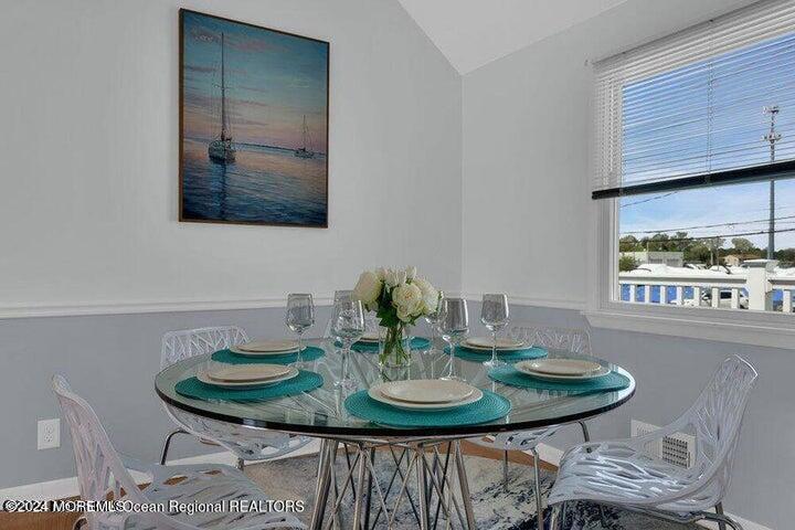 3125 Creek Road Toms River, NJ 08753 - Photo 13 of 60 a view of a dining room with furniture and wooden floor