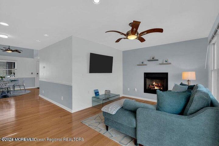 3125 Creek Road Toms River, NJ 08753 - Photo 18 of 60 a living room with furniture and a fireplace