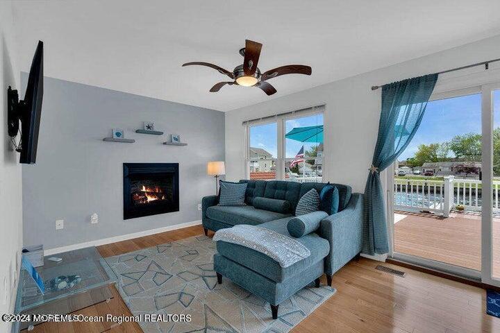 3125 Creek Road Toms River, NJ 08753 - Photo 2 of 60 a living room with furniture a fireplace and a flat screen tv