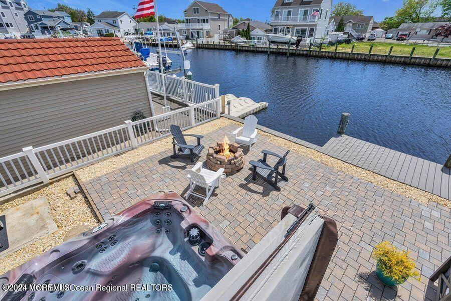 3125 Creek Road Toms River, NJ 08753 - Photo 38 of 60 a view of a balcony with chairs and wooden floor