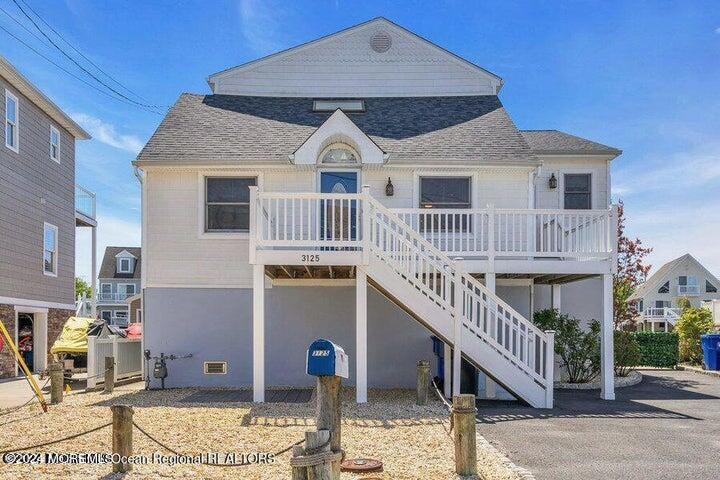 3125 Creek Road Toms River, NJ 08753 - Photo 4 of 60 a front view of a house with a balcony