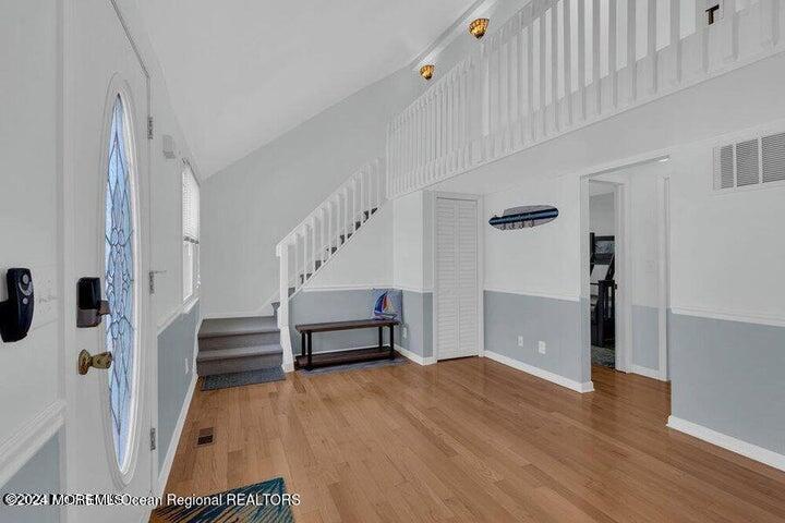 3125 Creek Road Toms River, NJ 08753 - Photo 10 of 60 a view of entryway with wooden floor and stairs