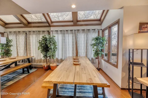 a living room with fireplace furniture and a flat screen tv