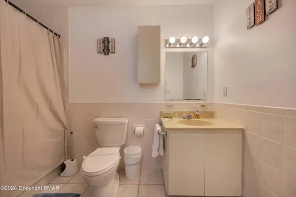 a bedroom with a bed and a table