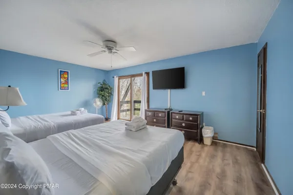a bathroom with a sink a mirror and a shower