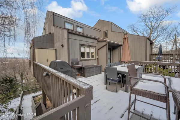a view of a dinning table and chairs in the patio